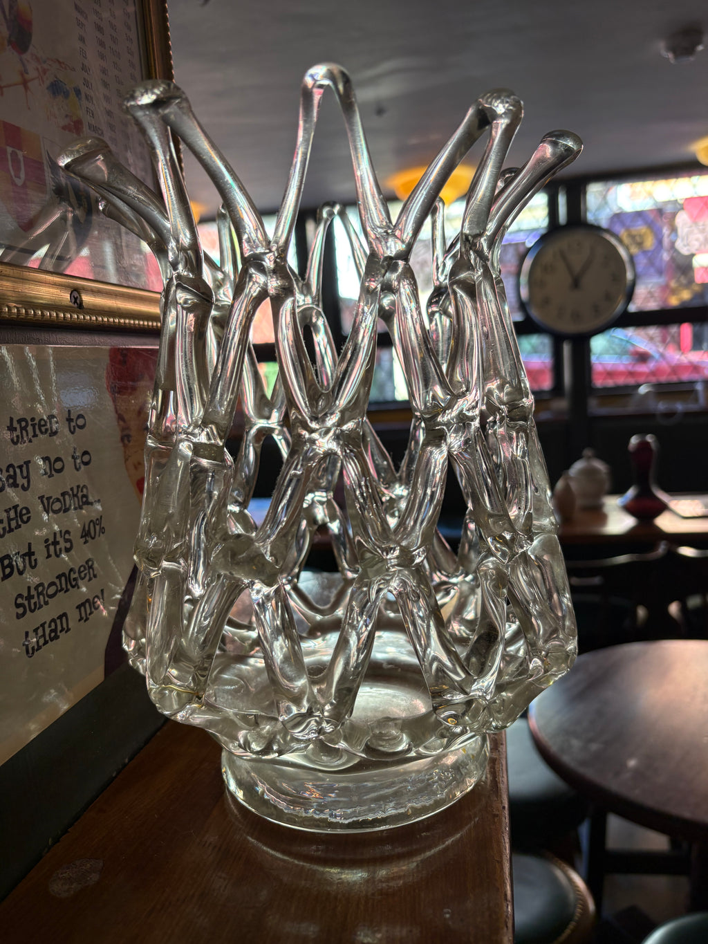 Angled view of clear glass lattice vase showing its open framework and circular base