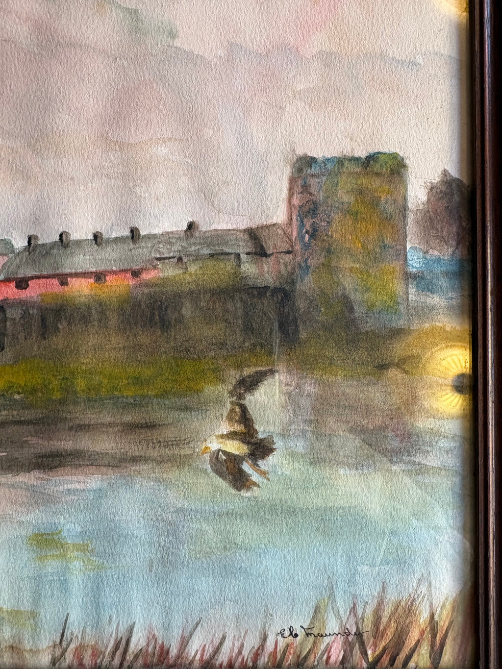 Right-side riverside town detail showing a stone tower, small boat and lower-right signature.