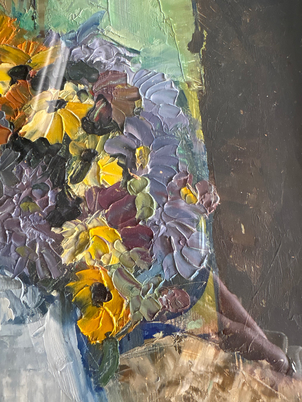 Right-side bouquet detail showing raised yellow and purple flower petals against a green and dark background.