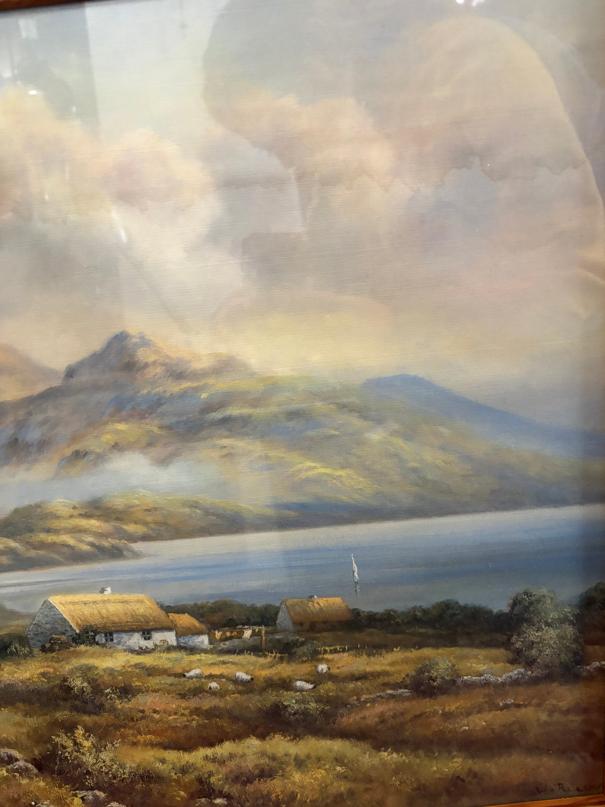 Right-side landscape detail showing thatched cottages, a sailboat on the loch and misty mountains.