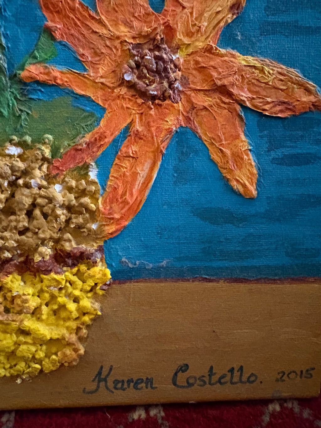 Lower-right detail of the floral painting showing the Costello signature and 2015 date.