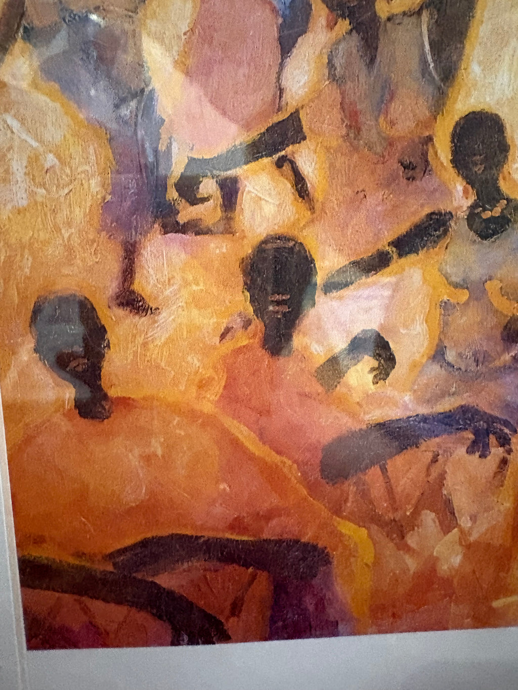 Lower detail of the dancing figures artwork showing outstretched arms and orange and pink clothing.