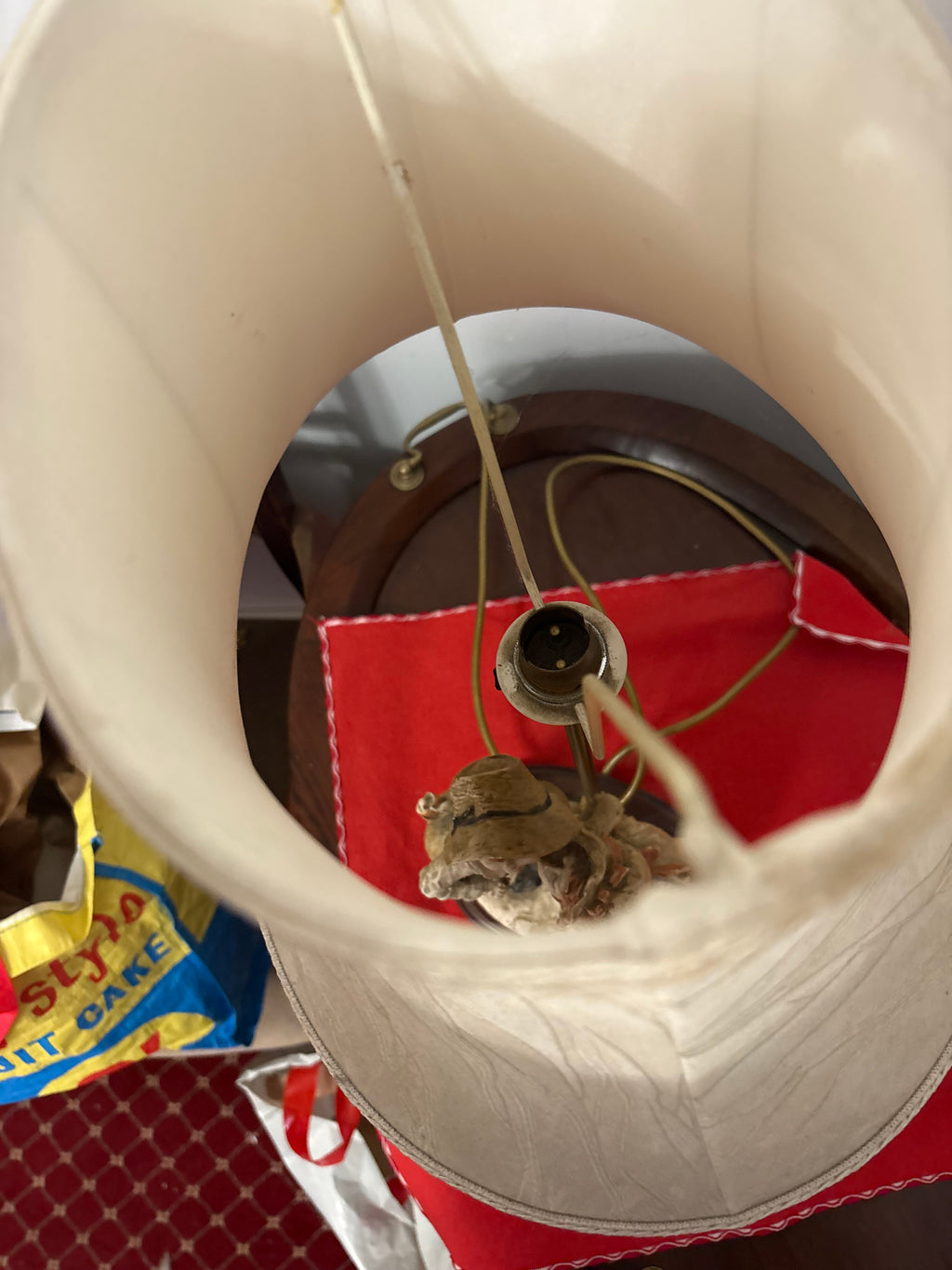 Overhead view into the Shy Kiss lamp shade showing the bulb holder and support frame