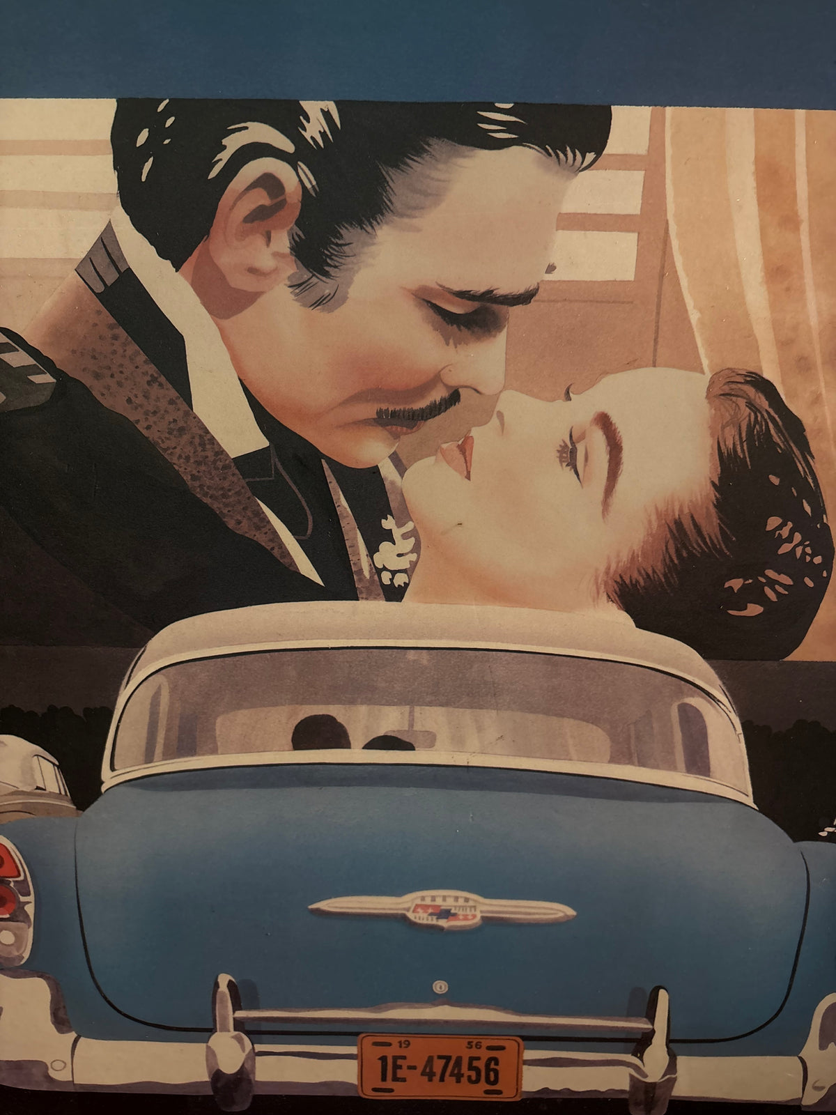 Central drive-in print detail showing a couple on screen above the rear of a blue classic car.