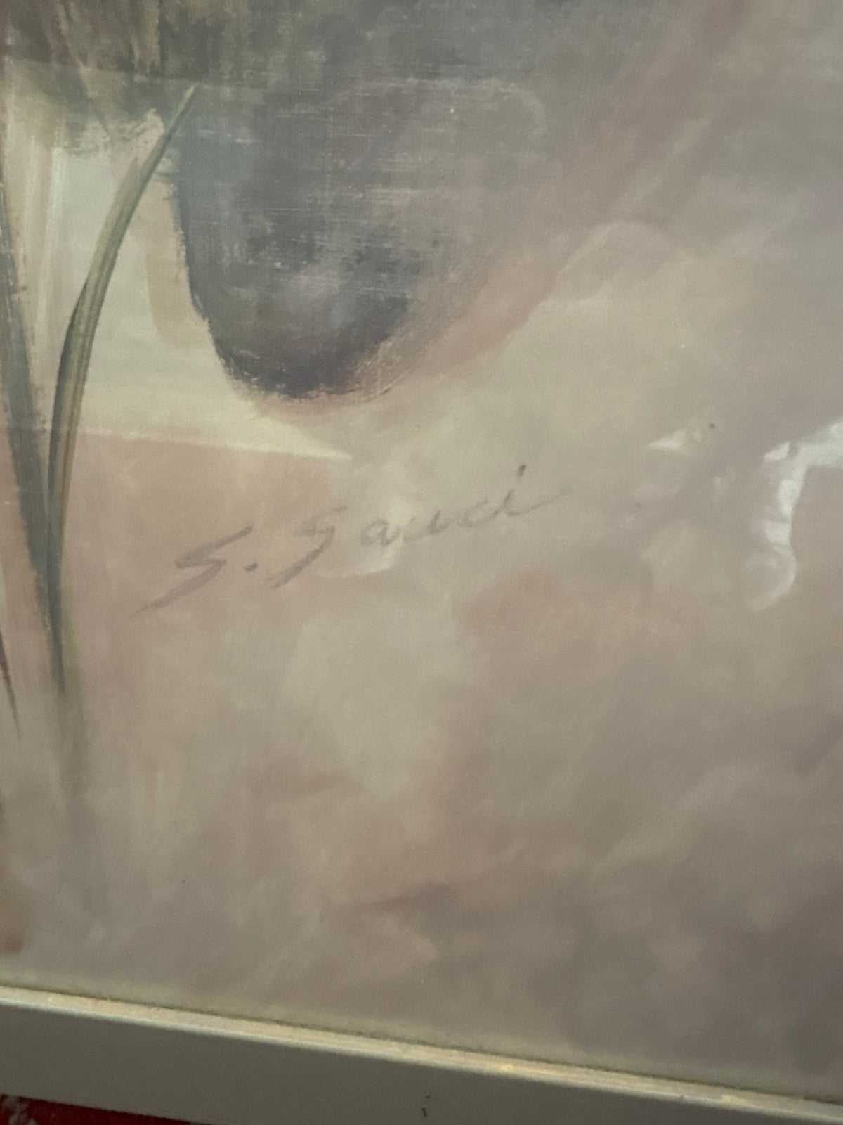 Lower-right calla lily picture detail showing a faint signature beneath a large leaf.