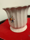 Cream fluted ceramic planter with scalloped rim, raised foot and colourful fruit decoration