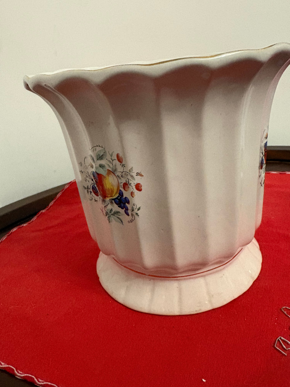 Cream fluted ceramic planter with scalloped rim, raised foot and colourful fruit decoration