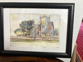 Framed church watercolour with a square stone tower, trees and cream mount.