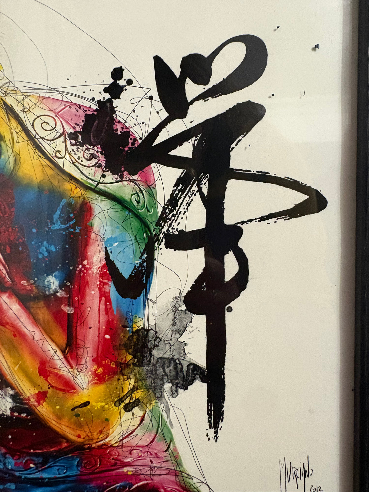 Black calligraphic marks and Murciano signature beside the colourful Buddha figure.