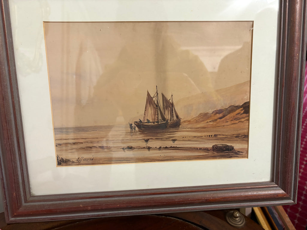 Framed maritime watercolour of beached sailing boats beside sandy dunes.